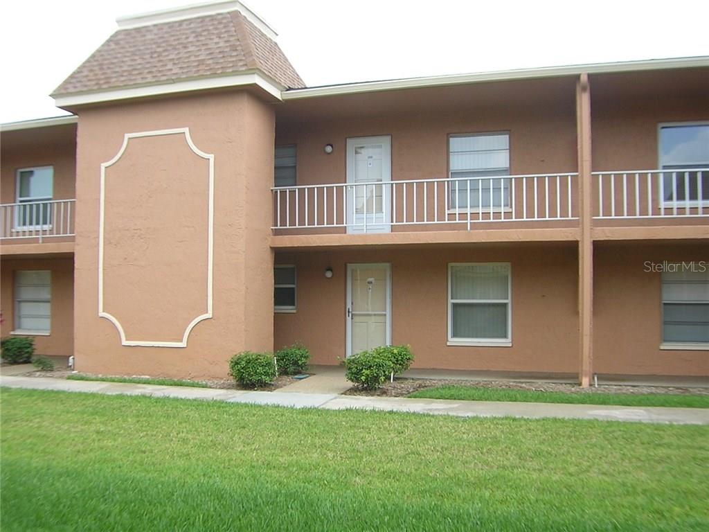 12760 Indian Rocks Road, Unit 903 Largo, FL 33774 - Photo 1 of 1 a front view of a house with a yard