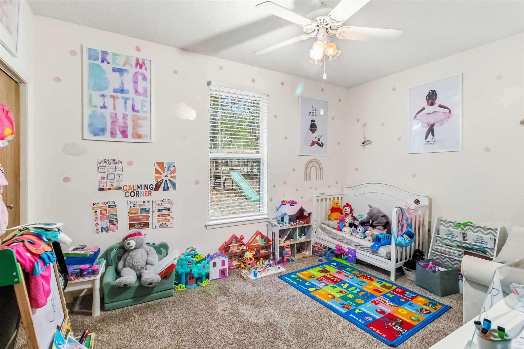 581 State Highway 95 Elgin, TX 78621 - Photo 12 of 30 a play room with toys and a book shelf