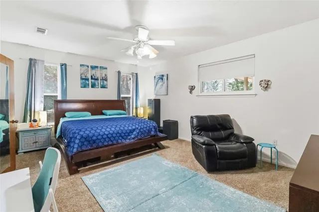a living room with a couch and a chandelier