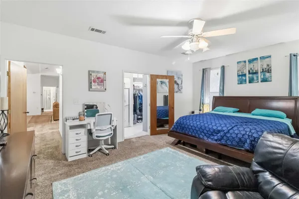 a living room with a couch and a chandelier
