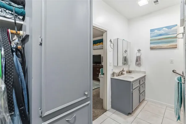 a bathroom with a sink a vanity and a mirror