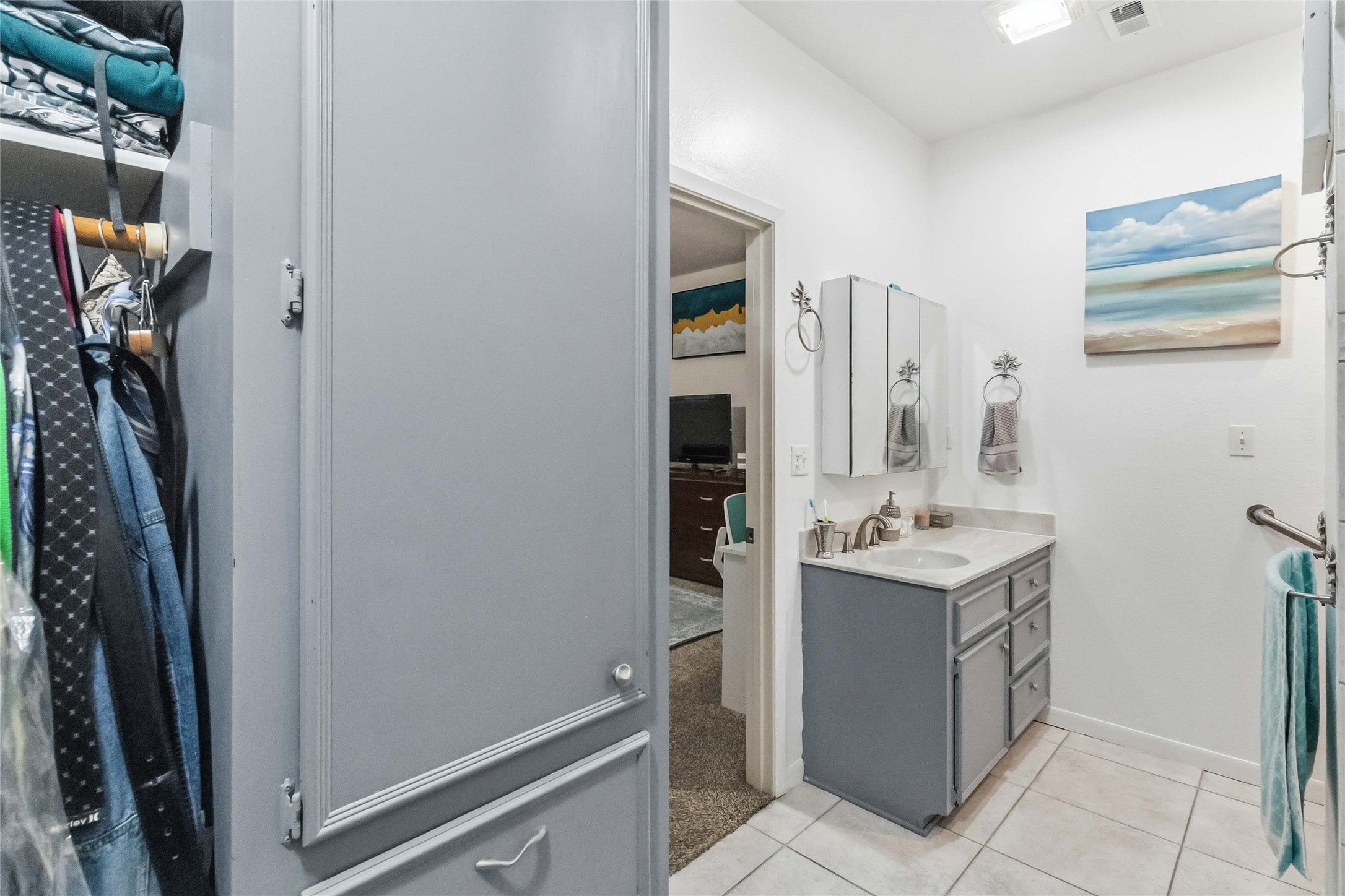 581 State Highway 95 Elgin, TX 78621 - Photo 18 of 30 a bathroom with a sink a vanity and a mirror