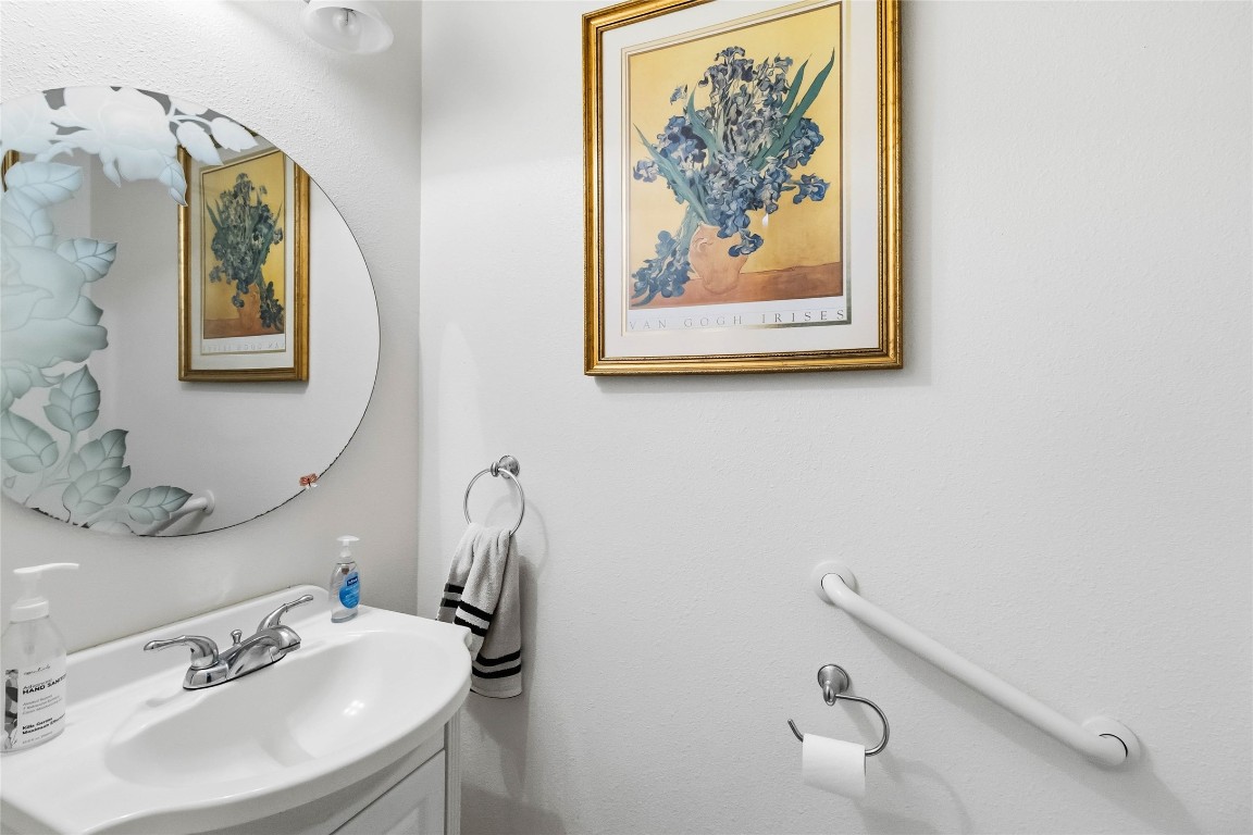 581 State Highway 95 Elgin, TX 78621 - Photo 23 of 30 a bathroom with a sink mirror and vanity