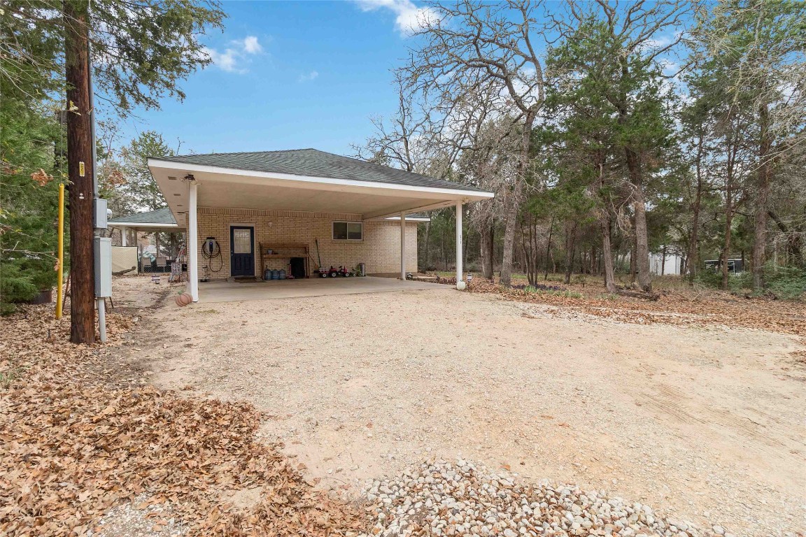 581 State Highway 95 Elgin, TX 78621 - Photo 26 of 30 a view of a house with a yard and garage