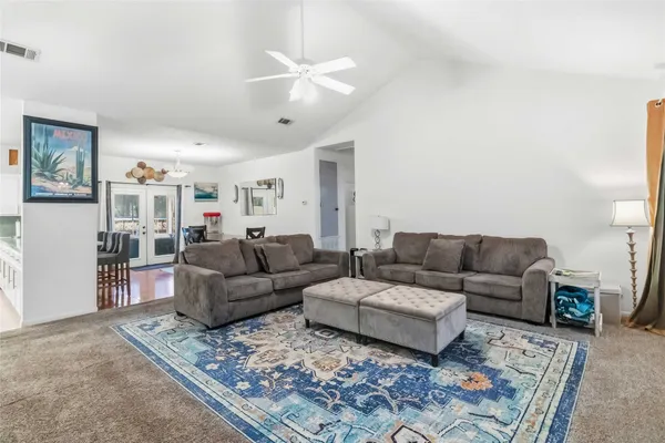 a living room with furniture and a rug