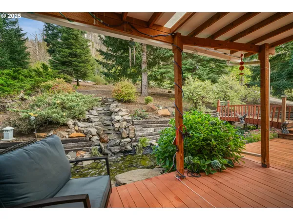 a building outdoor space with patio furniture and potted plants