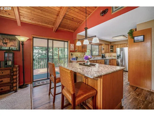 a kitchen with a table and chairs in it