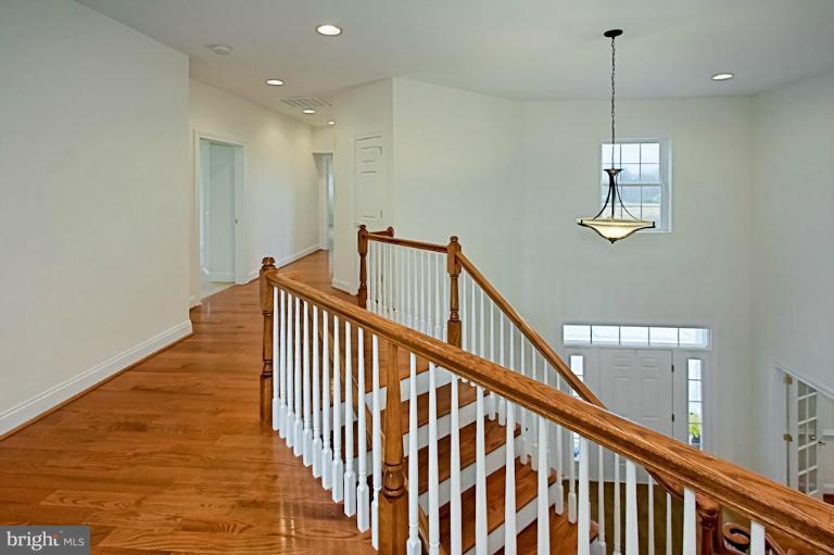 7003 Springville Court Springfield, VA 22150 - Photo 8 of 30 Wide Upstairs Hardwood Hallway