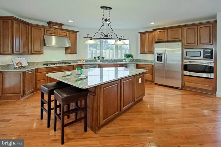 7003 Springville Court Springfield, VA 22150 - Photo 10 of 30 Large Breakfast Bar/ Island in Kitchen