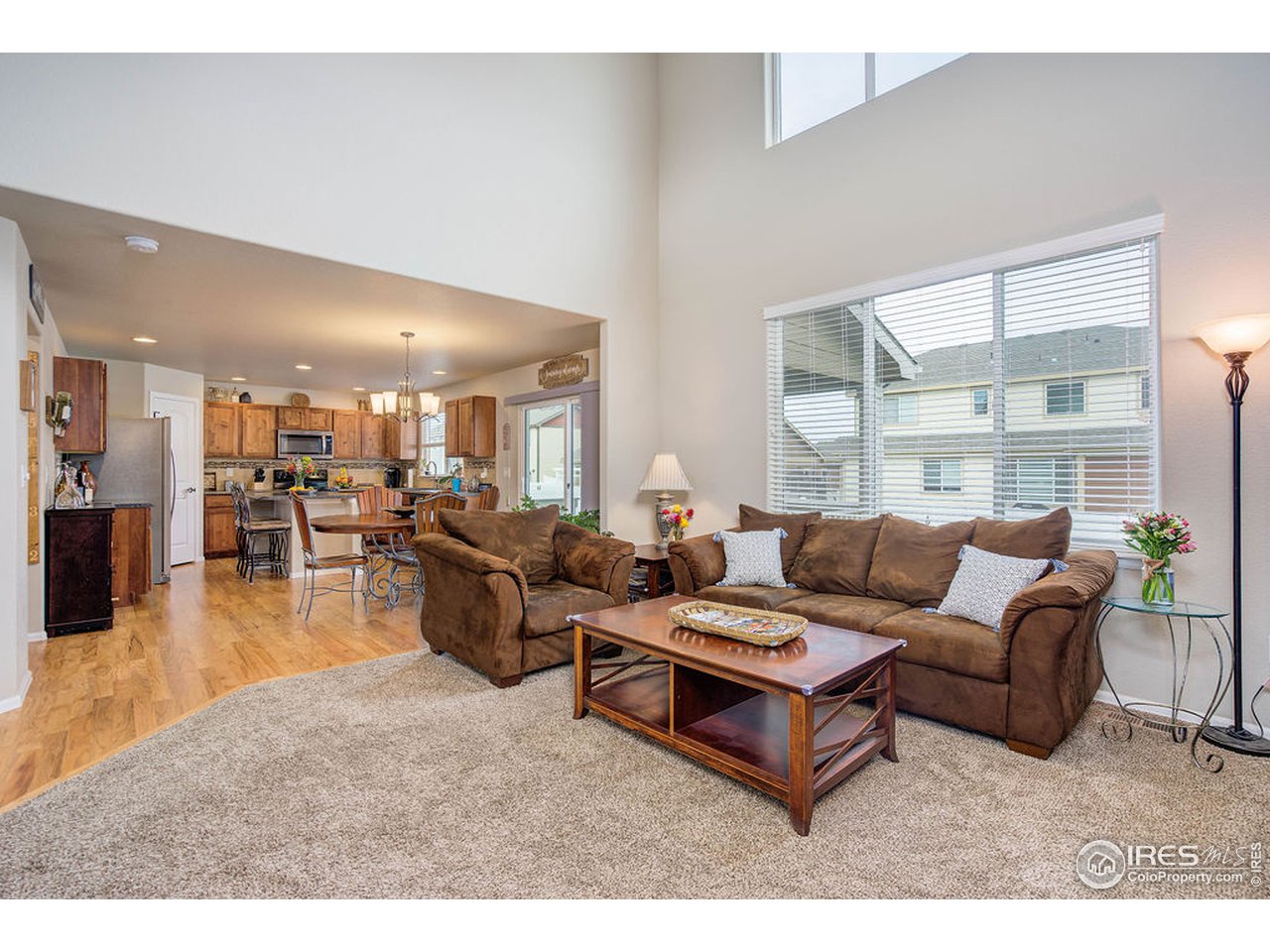 8835 16th St Road Greeley, CO 80634 - Photo 12 of 37 Living Room Open to Kitchen