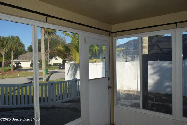 a view of a hallway with a chandelier