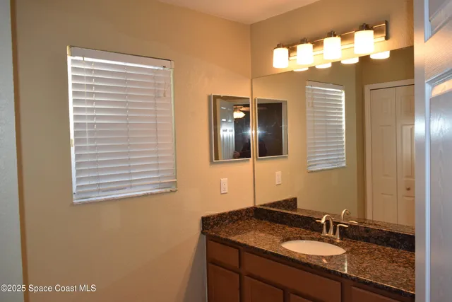a white toilet sitting next to a bath tub