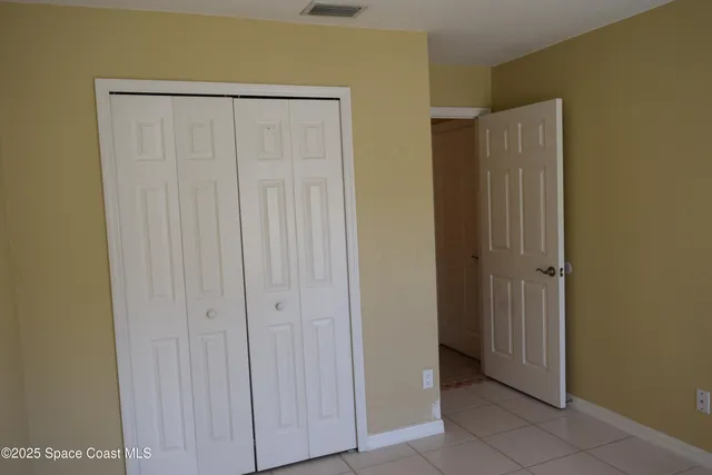 a white toilet sitting next to a shower curtain