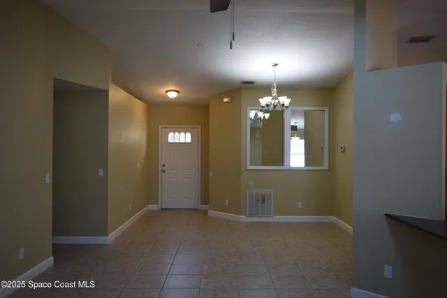 a kitchen with kitchen island a sink stainless steel appliances and cabinets