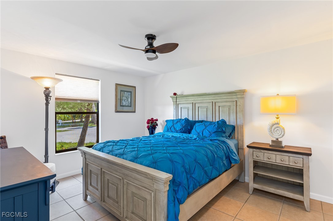 170 5th Street South Naples, FL 34113 - Photo 11 of 23 a bedroom with a bed and a dresser