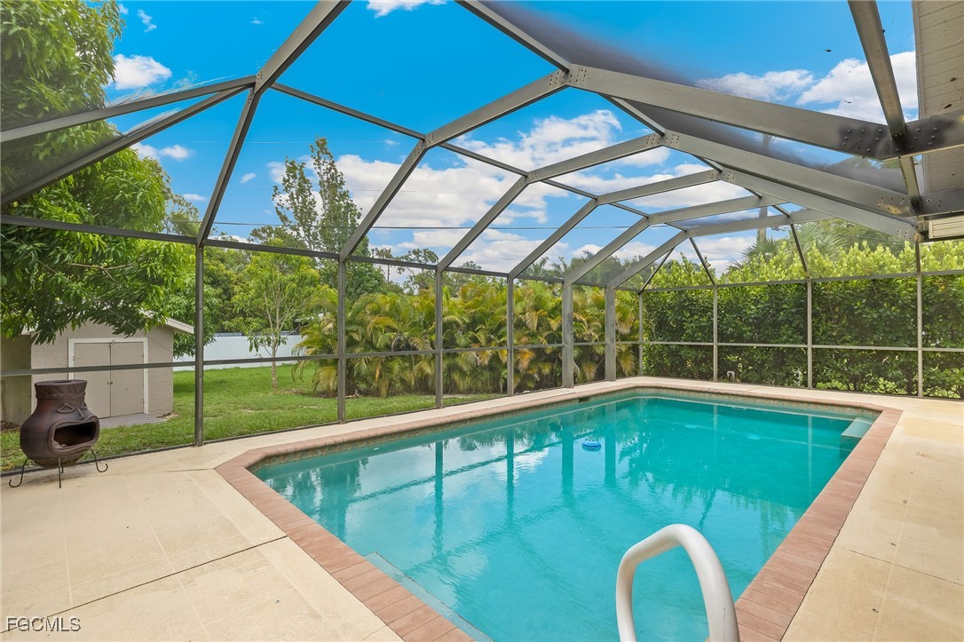 170 5th Street South Naples, FL 34113 - Photo 19 of 23 a view of a swimming pool with a porch