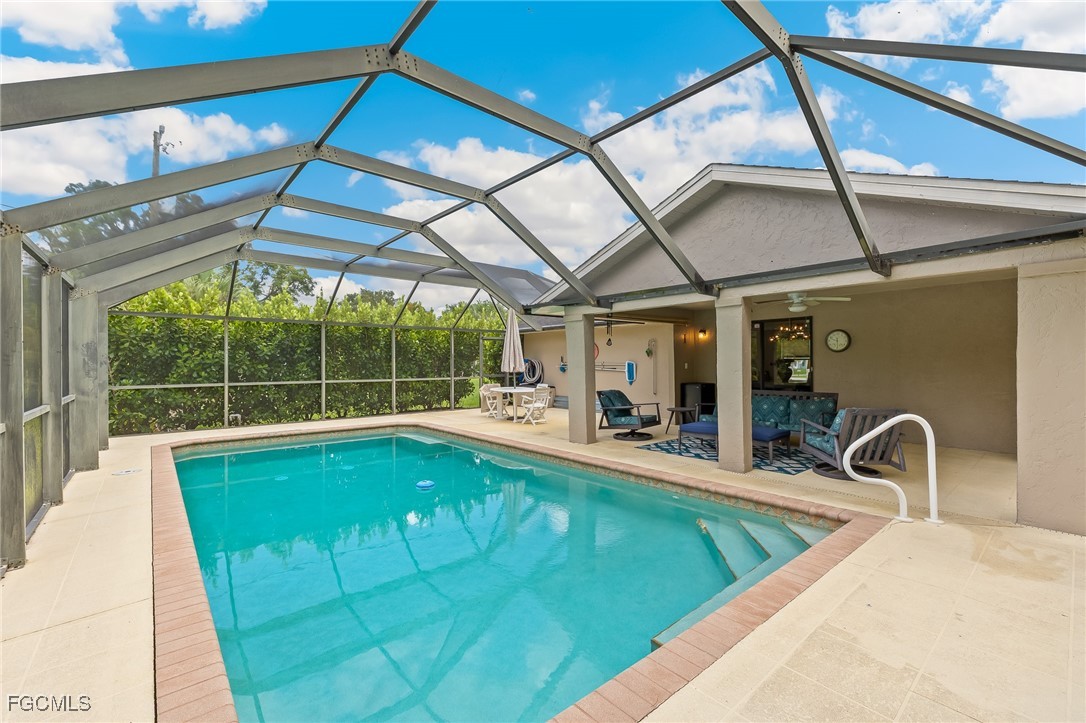 170 5th Street South Naples, FL 34113 - Photo 20 of 23 a view of a swimming pool with a patio and a backyard