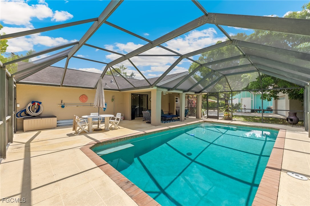 170 5th Street South Naples, FL 34113 - Photo 21 of 23 a view of a swimming pool with a patio