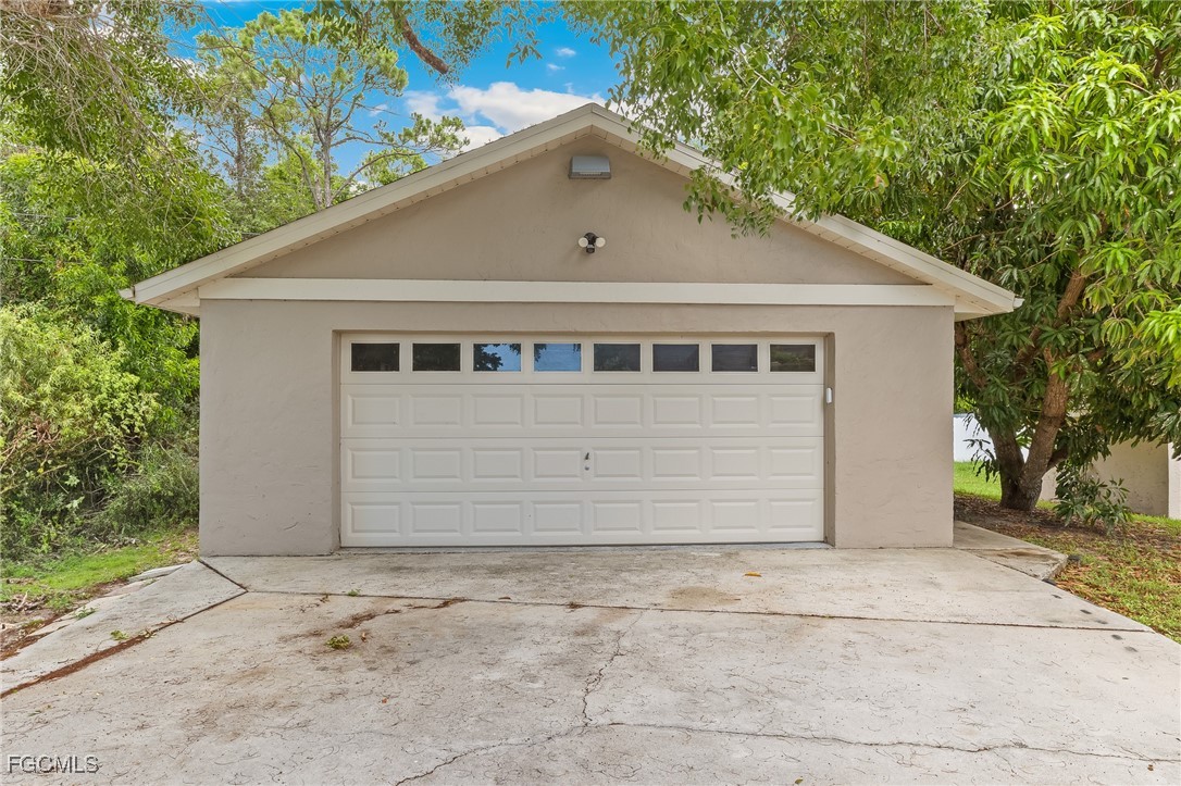 170 5th Street South Naples, FL 34113 - Photo 3 of 23 a front view of a house with a yard