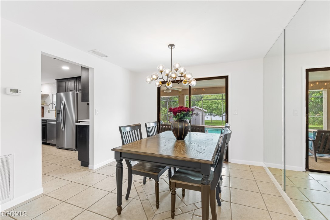 170 5th Street South Naples, FL 34113 - Photo 9 of 23 a dining room with furniture and window