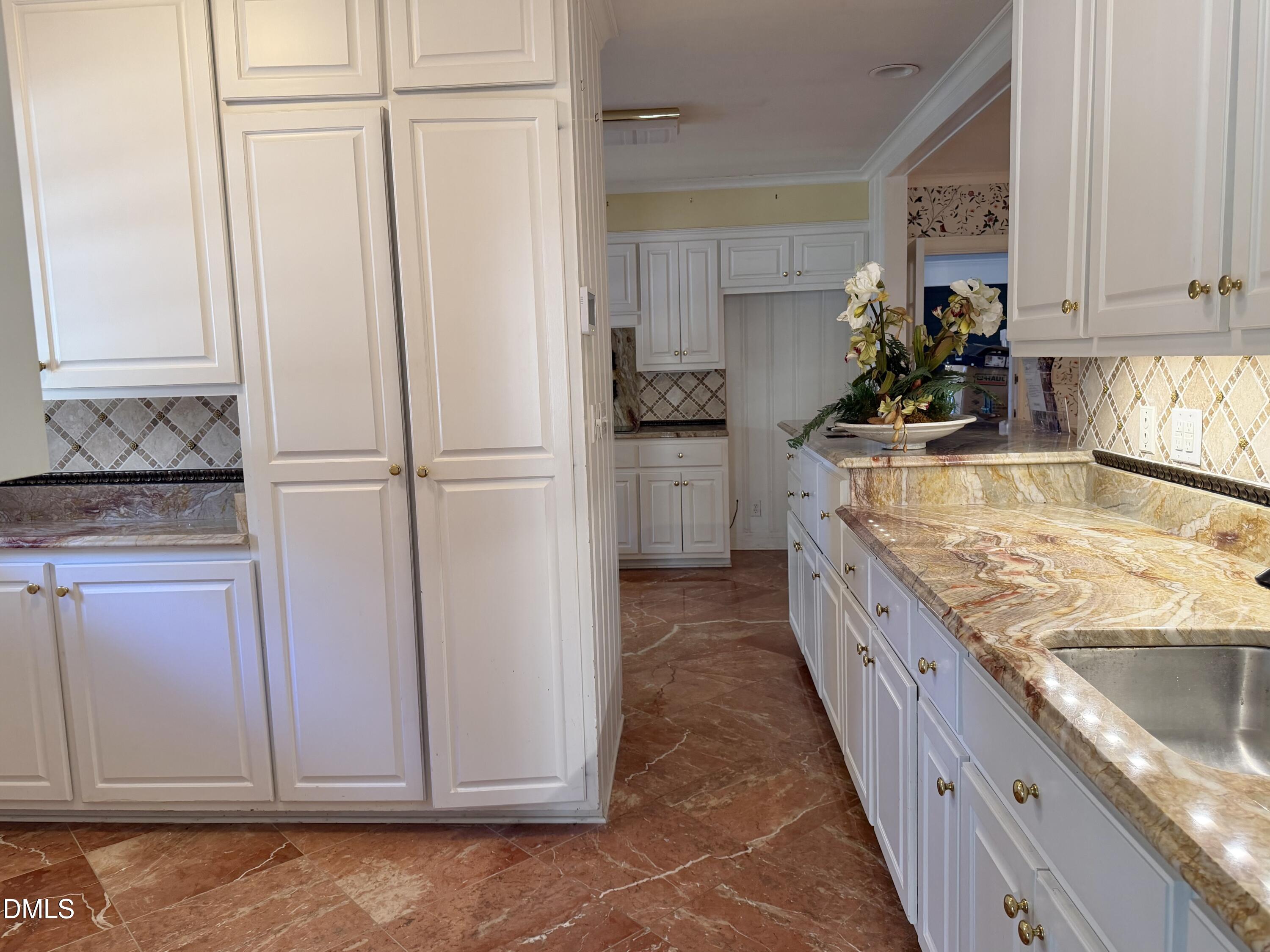 173 Park Circle Faison, NC 28341 - Photo 21 of 56 a kitchen with granite countertop cabinets and refrigerator