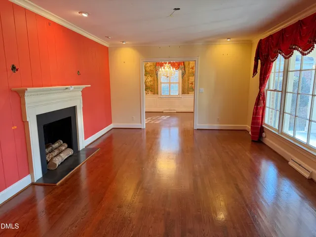 a spacious bathroom with a mirror and a shower