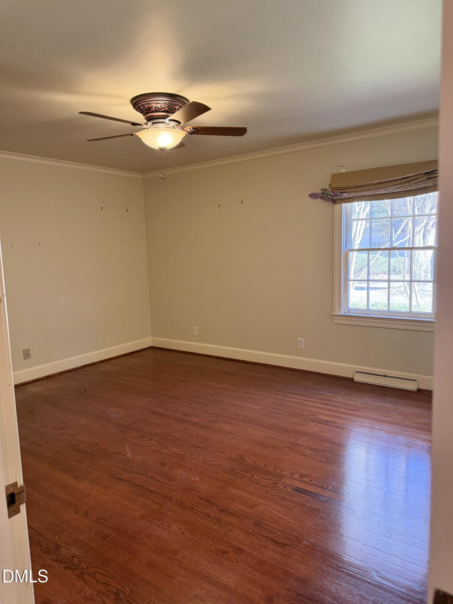 173 Park Circle Faison, NC 28341 - Photo 32 of 56 a view of an empty room with wooden floor and a window