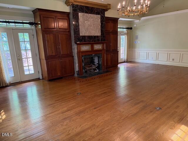 173 Park Circle Faison, NC 28341 - Photo 40 of 56 an empty room with wooden floor fireplace and windows