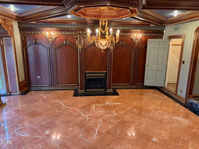 a view of a room with a wooden door