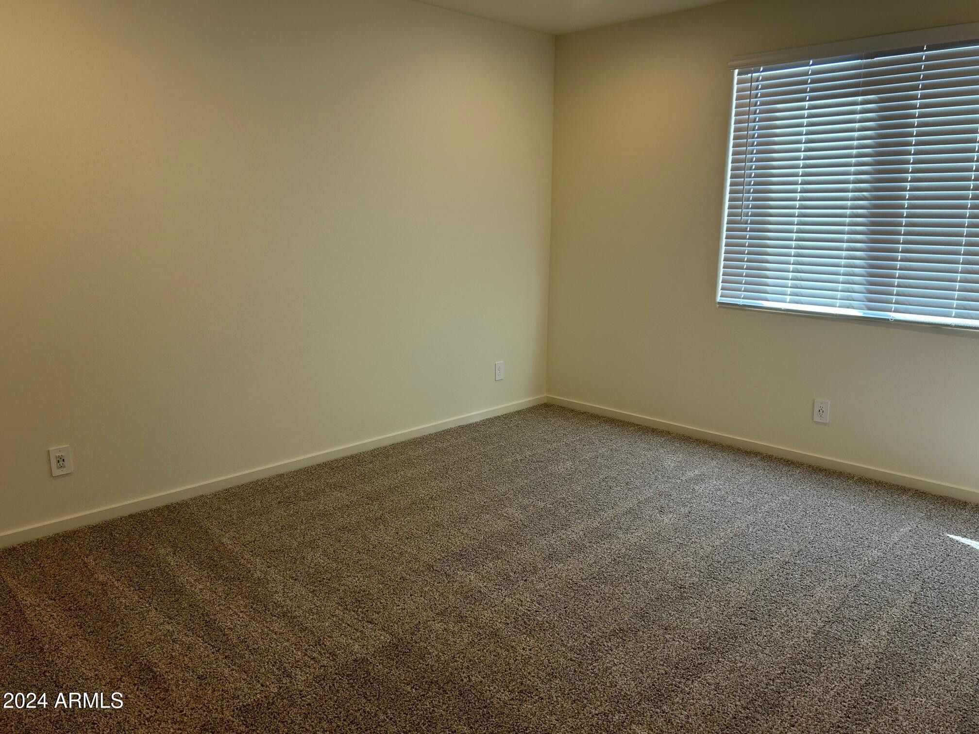 20520 North Candlelight Road Maricopa, AZ 85138 - Photo 13 of 18 an empty room with a window