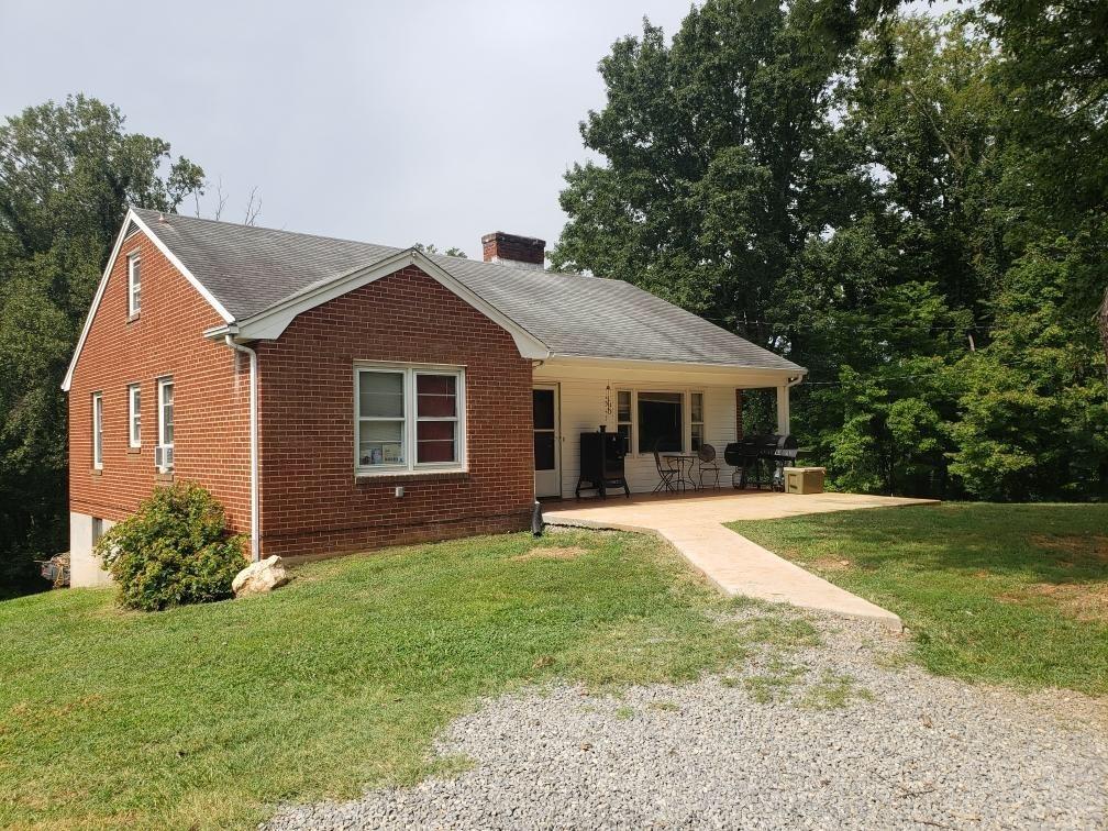 1811 Bandy Mill Road Hardy, VA 24101 - Photo 1 of 2 a front view of a house with a garden