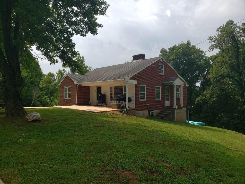 1811 Bandy Mill Road Hardy, VA 24101 - Photo 2 of 2 a front view of a house with a garden