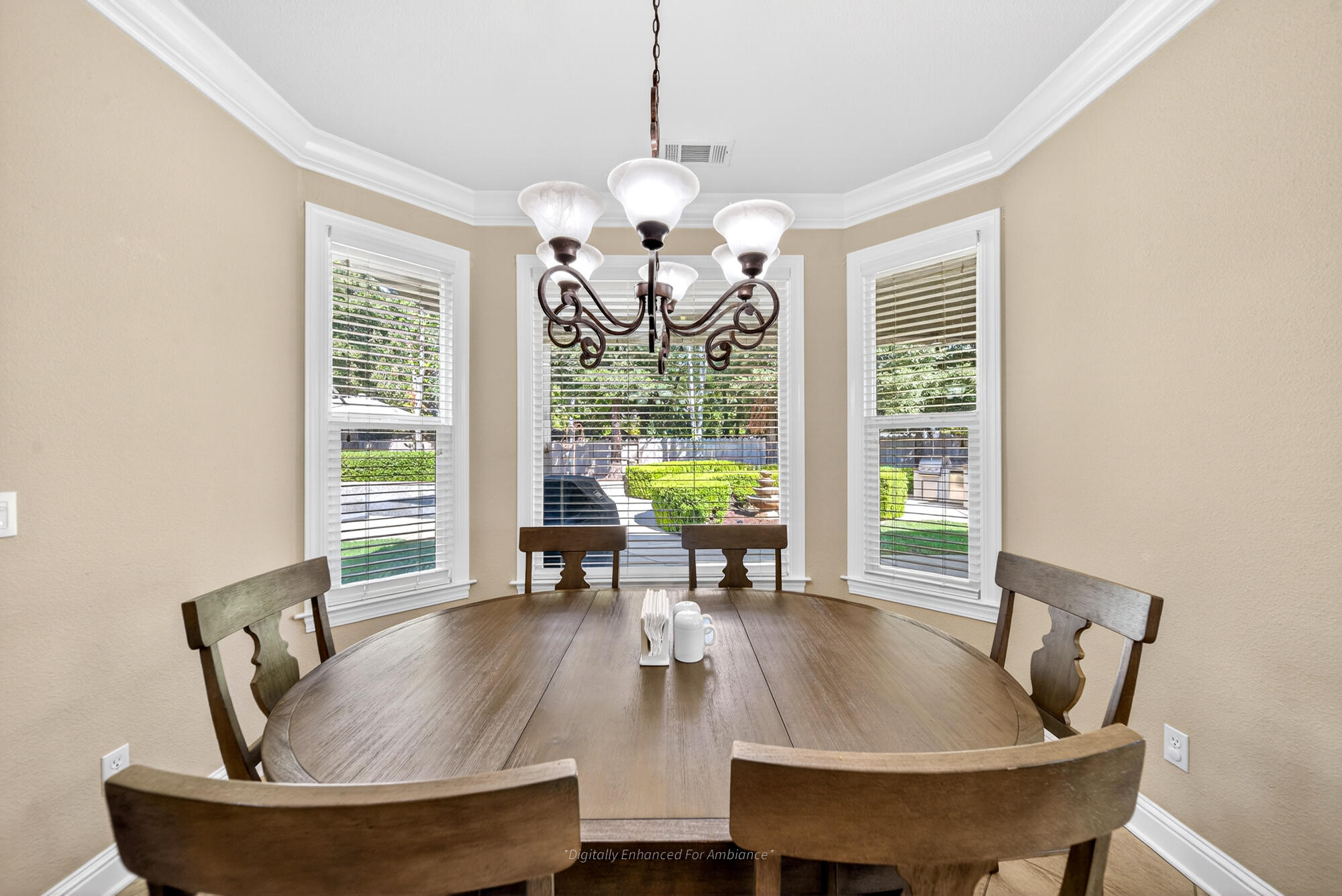 2722 Loggerhead Way Redding, CA 96002 - Photo 8 of 63 a dining room with wooden floor a chandelier a glass table and chairs