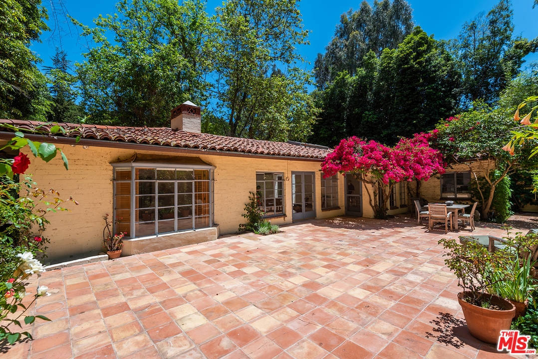 1491 Stone Canyon Road Los Angeles, CA 90077 - Photo 12 of 27 a view of a house with a porch