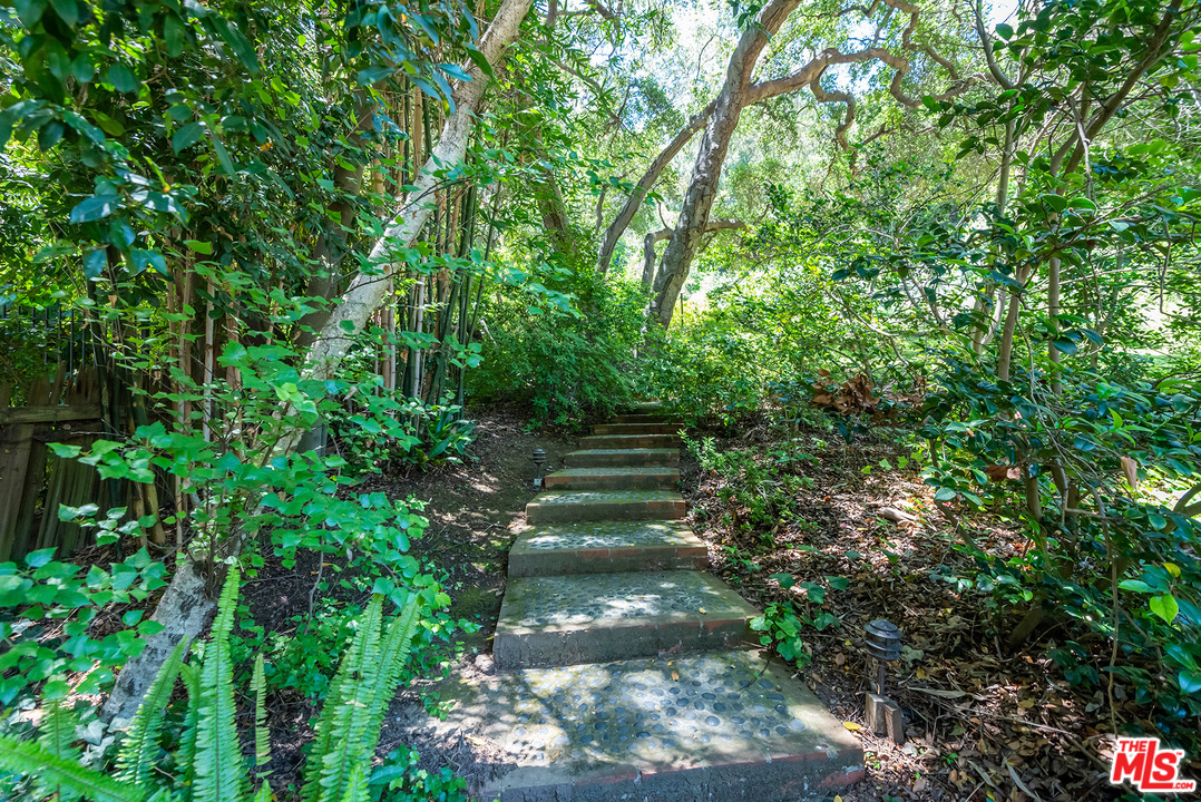 1491 Stone Canyon Road Los Angeles, CA 90077 - Photo 16 of 27 a view of path along with trees
