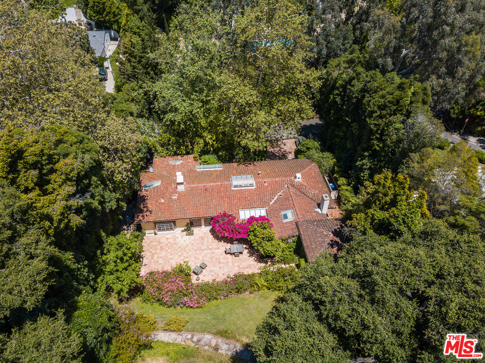 1491 Stone Canyon Road Los Angeles, CA 90077 - Photo 24 of 27 an aerial view of house with yard and swimming pool