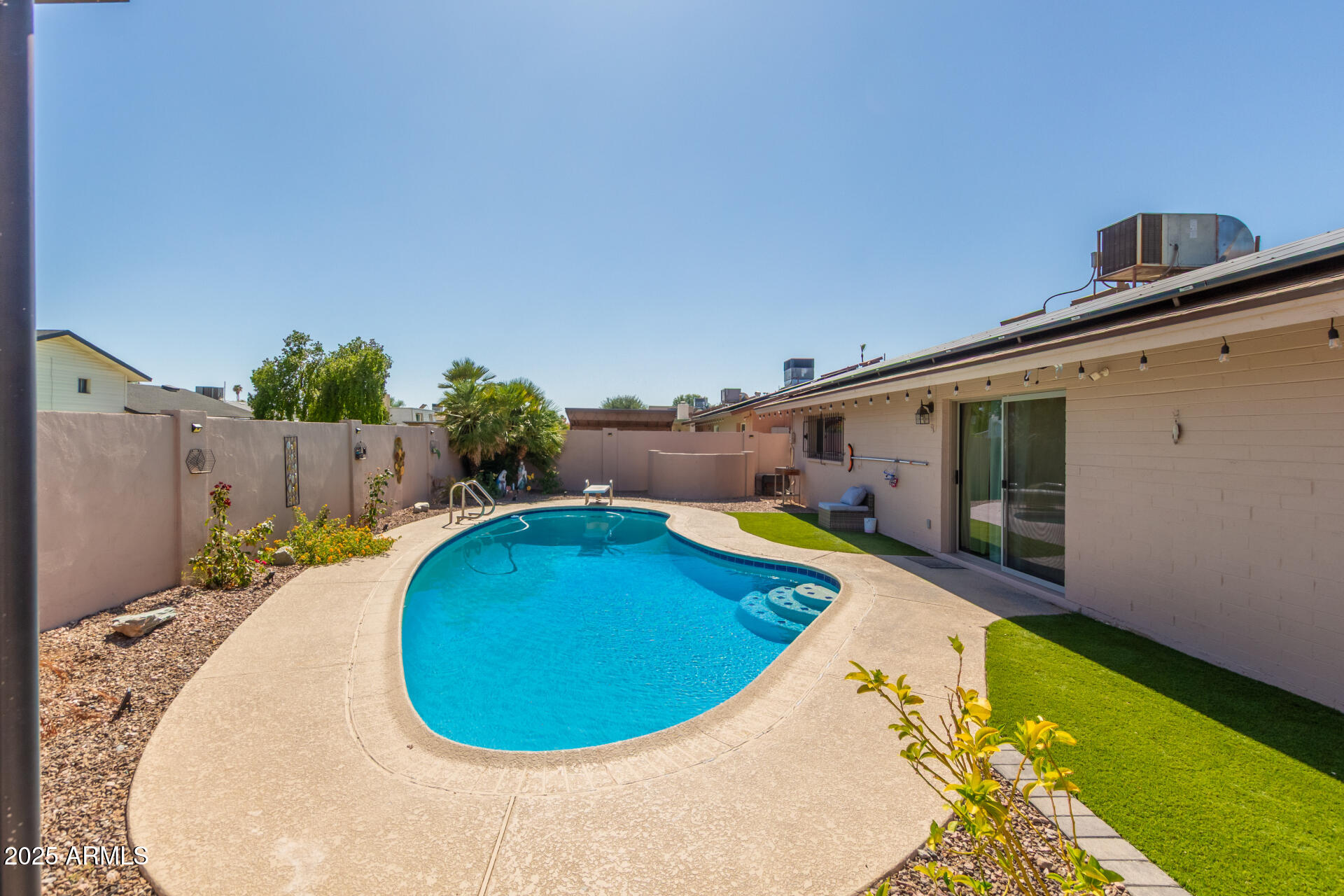 3529 West St Moritz Lane Phoenix, AZ 85053 - Photo 33 of 34 view of a swimming pool with an outdoor seating
