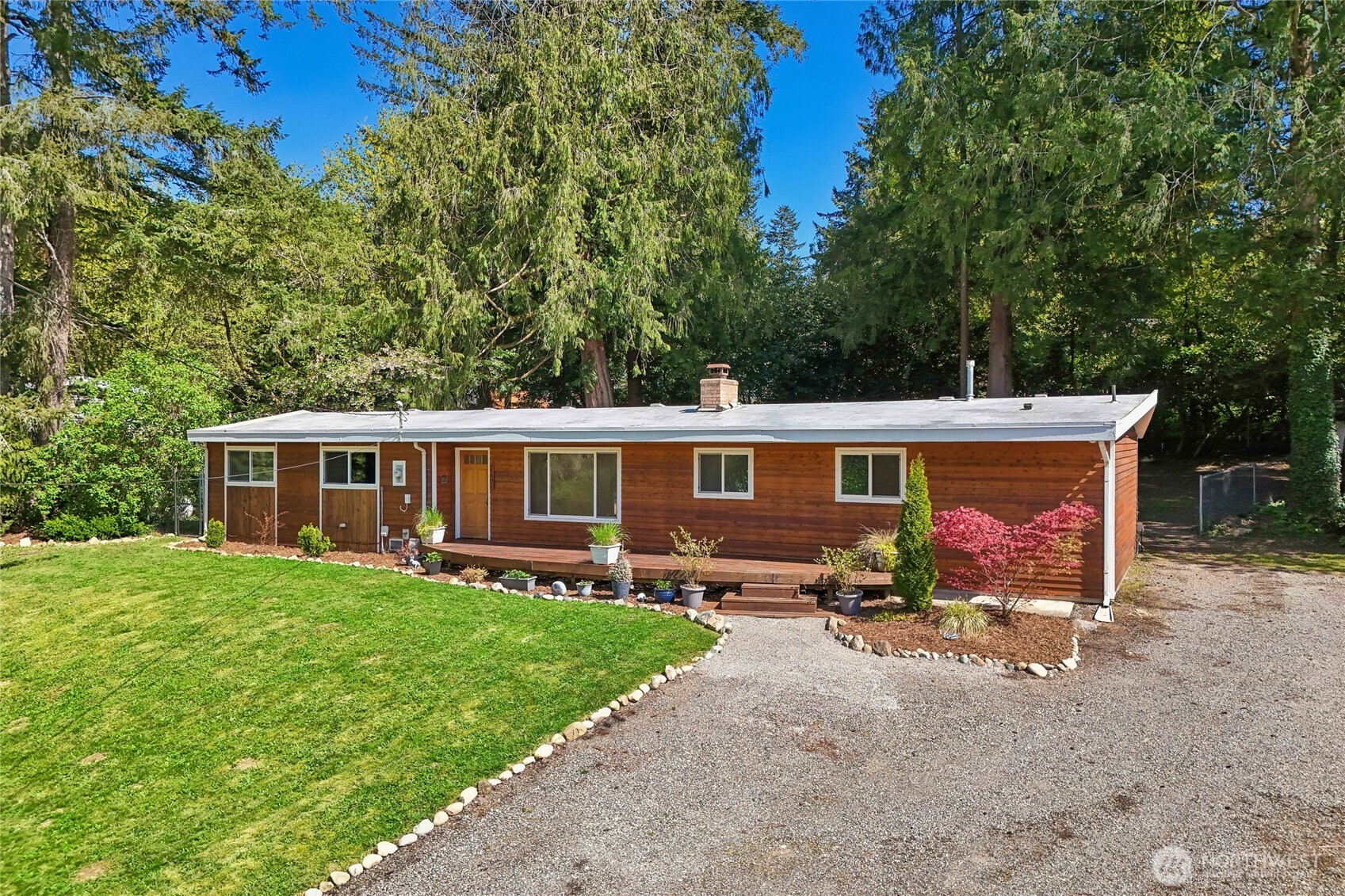 28601 Southeast 225th Street Maple Valley, WA 98038 - Photo 1 of 40 a view of a house with a yard in the back