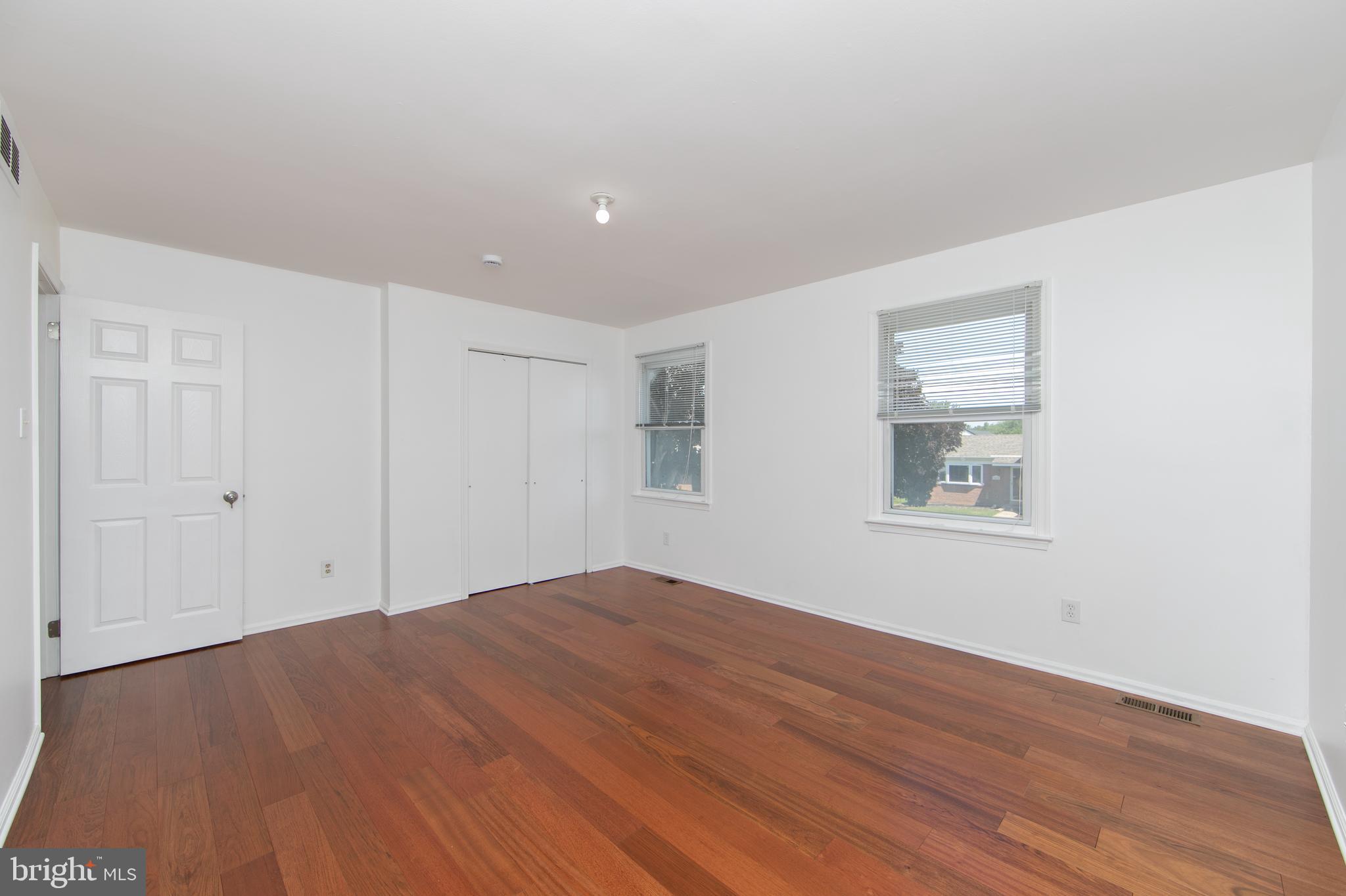 3007 Rampart Road Bensalem, PA 19020 - Photo 31 of 48 a view of empty room with wooden floor and fan