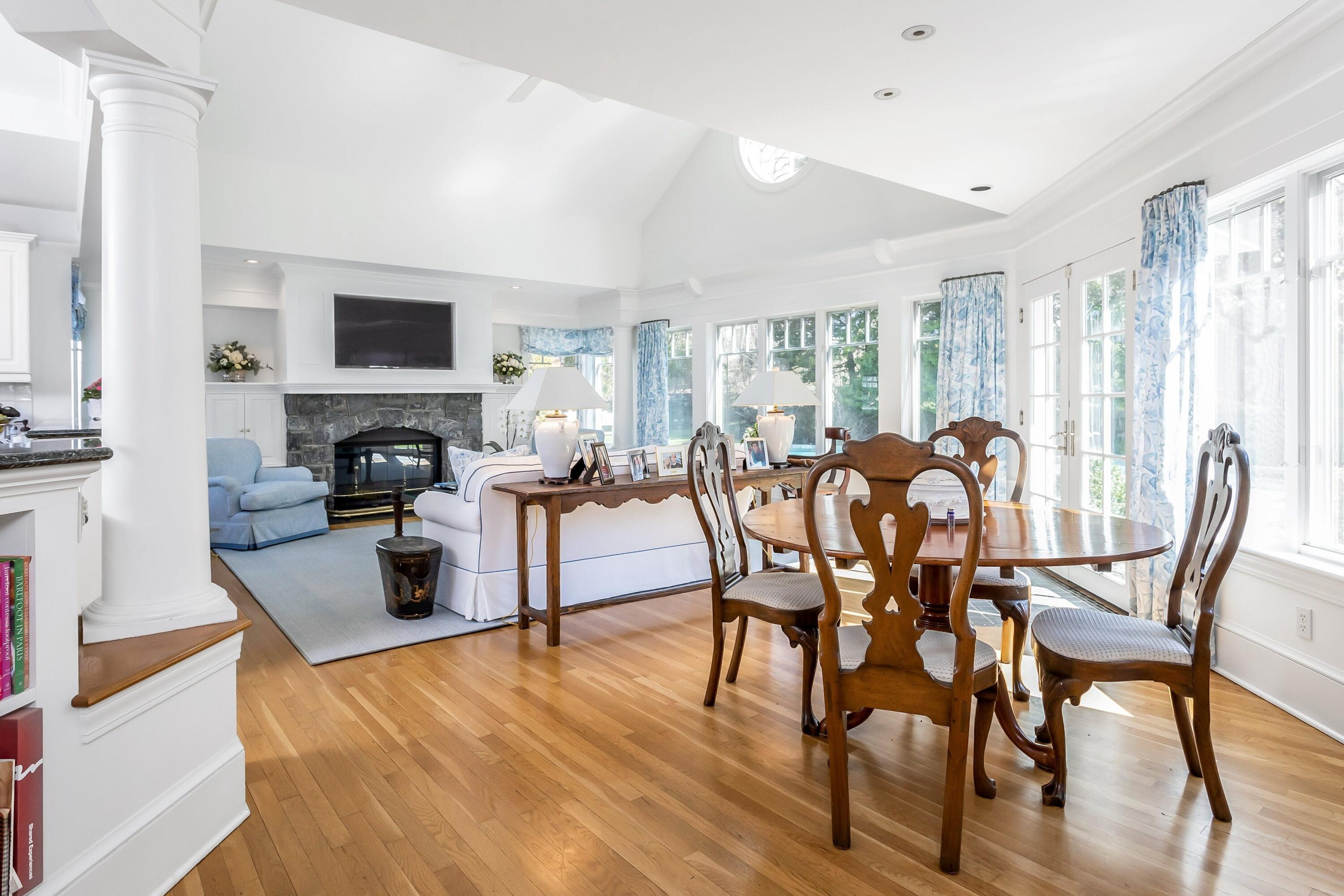 40 Birch Road Darien, CT 06820 - Photo 11 of 27 a view of a dining room with furniture and a fireplace