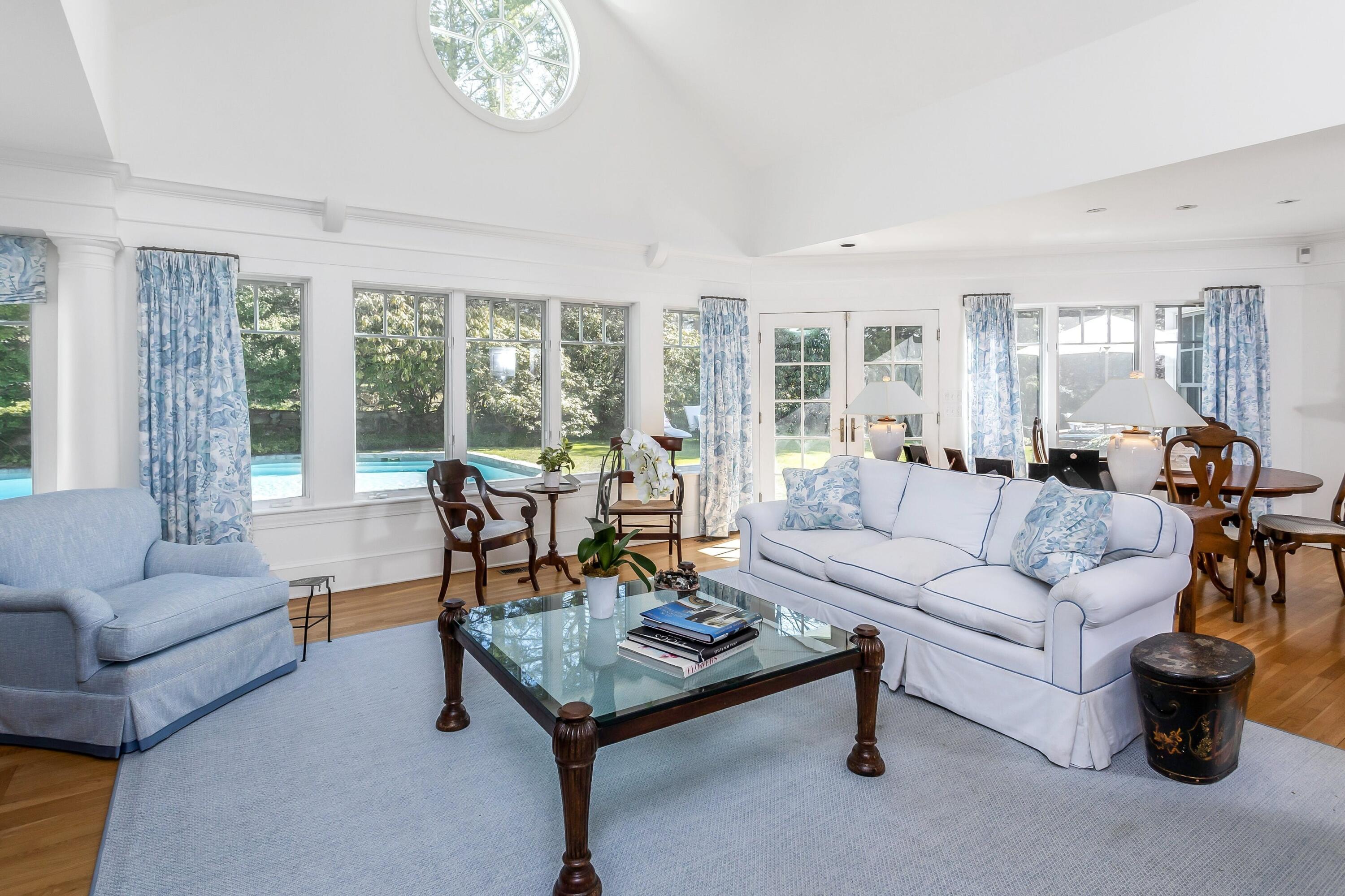 40 Birch Road Darien, CT 06820 - Photo 13 of 27 a living room with furniture a large window and a table