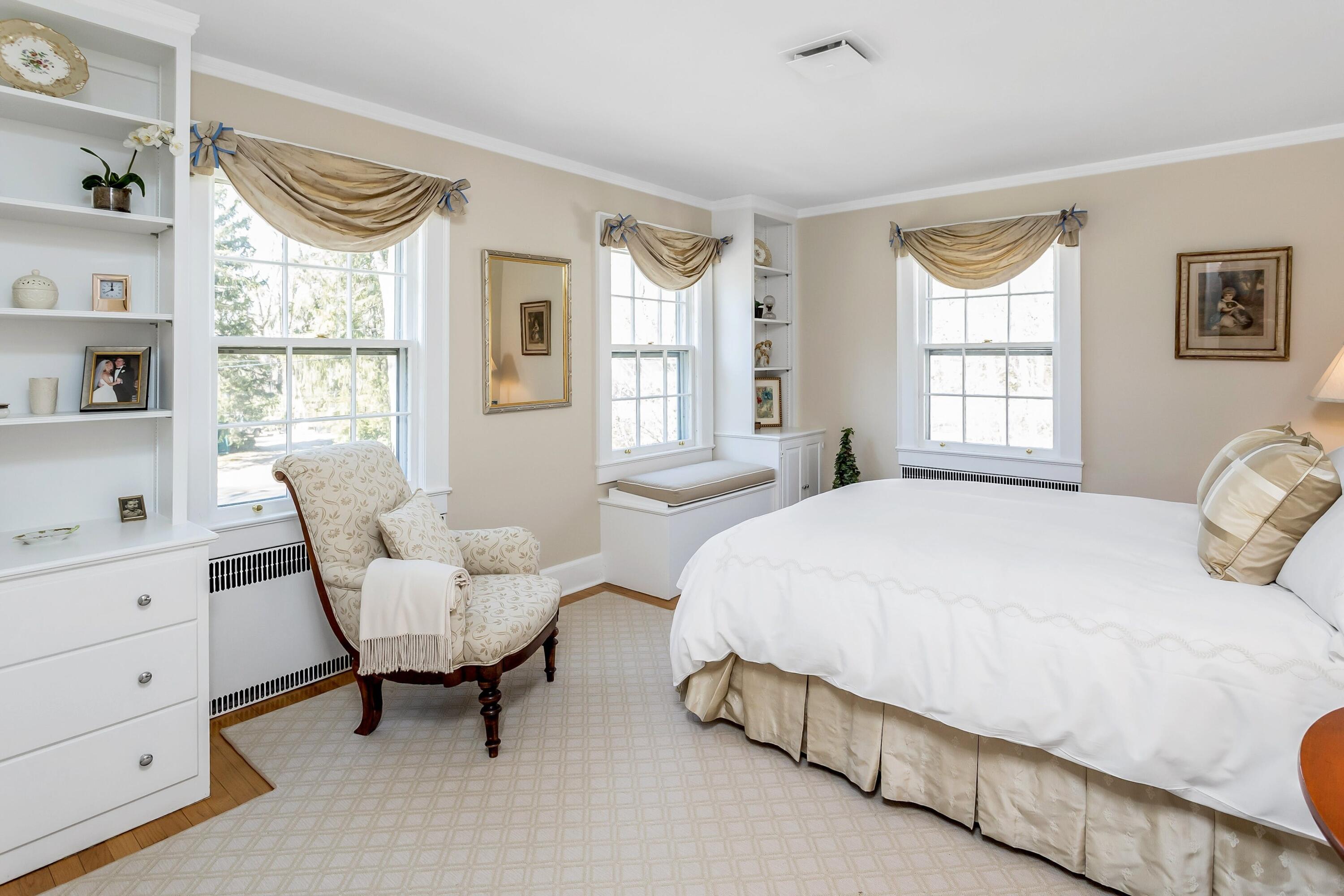 40 Birch Road Darien, CT 06820 - Photo 15 of 27 a spacious bedroom with a bed and a window