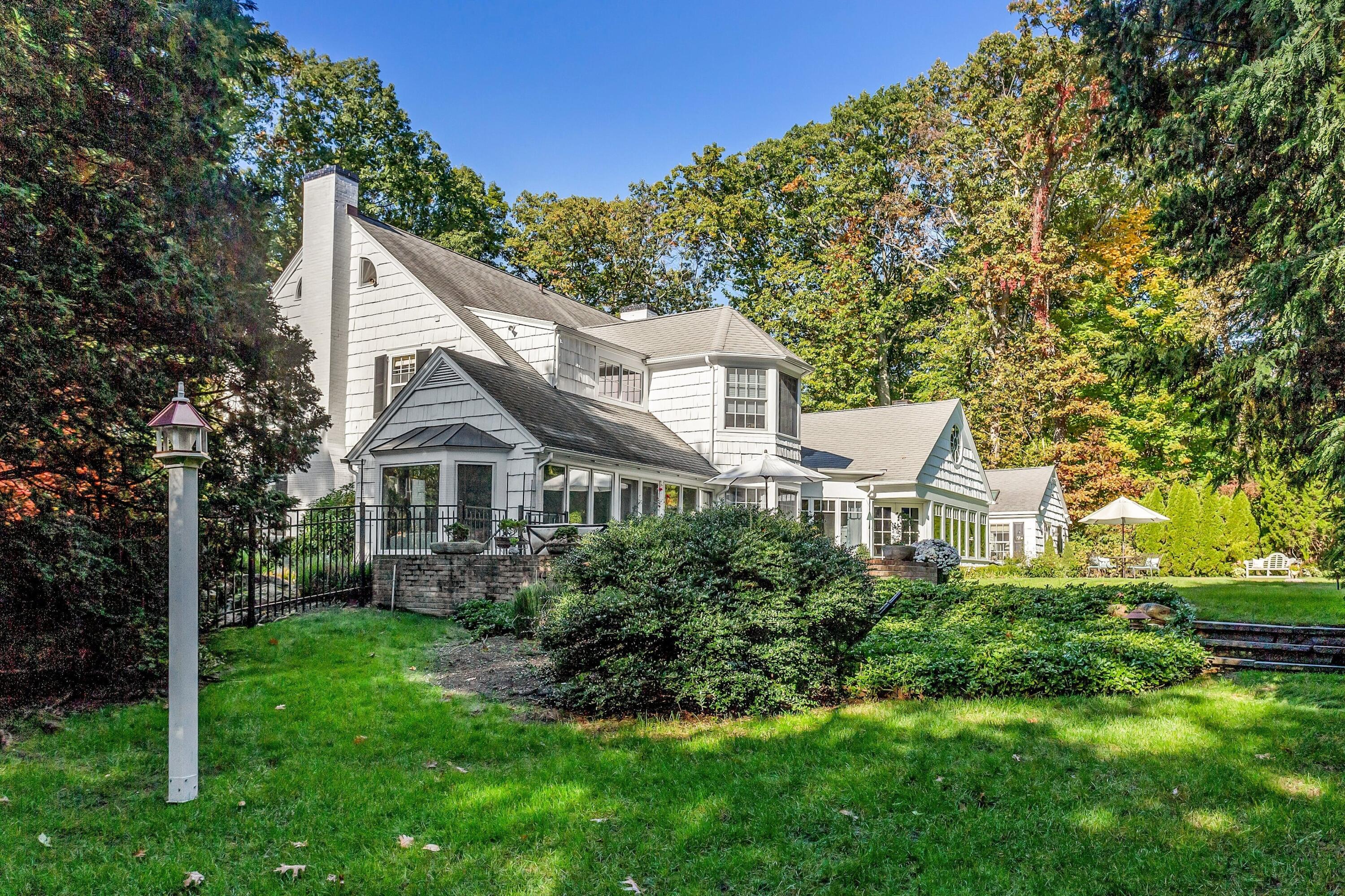 40 Birch Road Darien, CT 06820 - Photo 17 of 27 a view of a house with a big yard plants and large trees