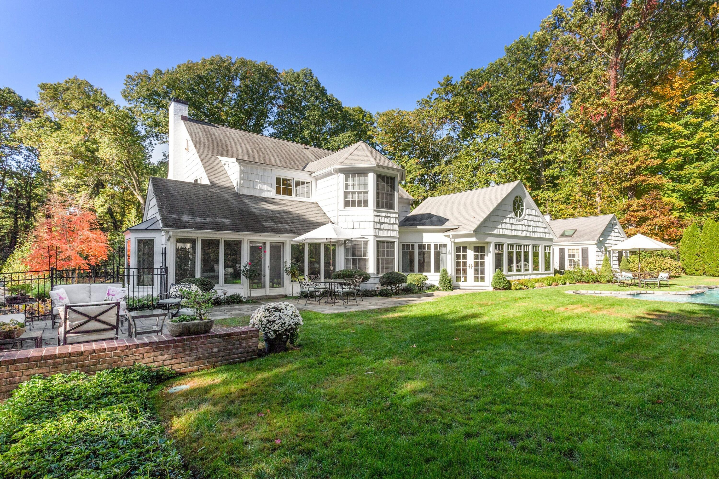 40 Birch Road Darien, CT 06820 - Photo 18 of 27 a front view of a house with a garden