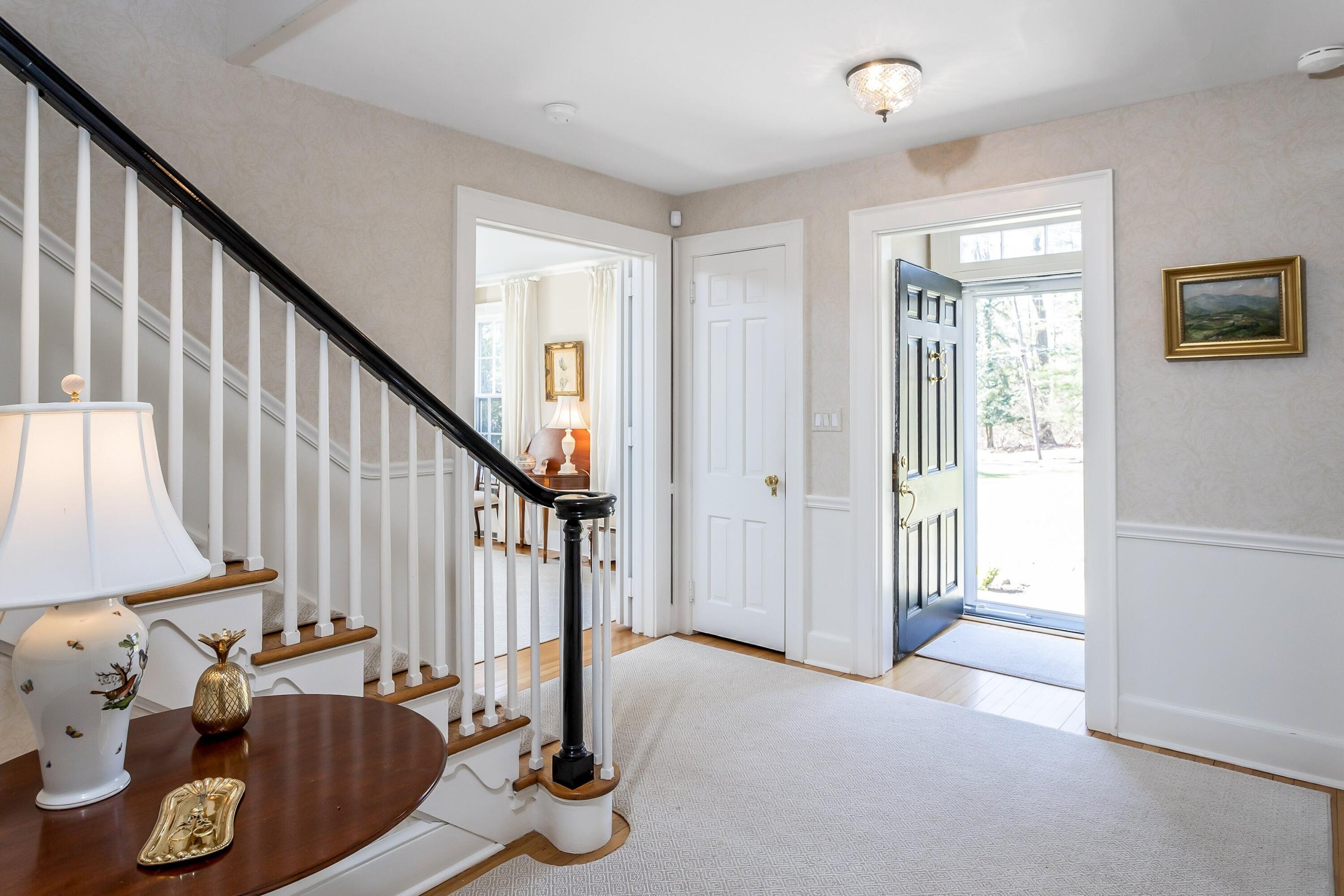 40 Birch Road Darien, CT 06820 - Photo 2 of 27 a view of an entryway with wooden floor and front door