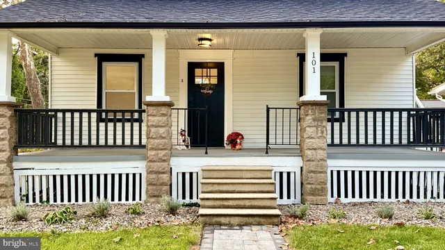 a view of a house with wooden fence