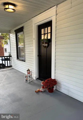 a view of a porch with a bench
