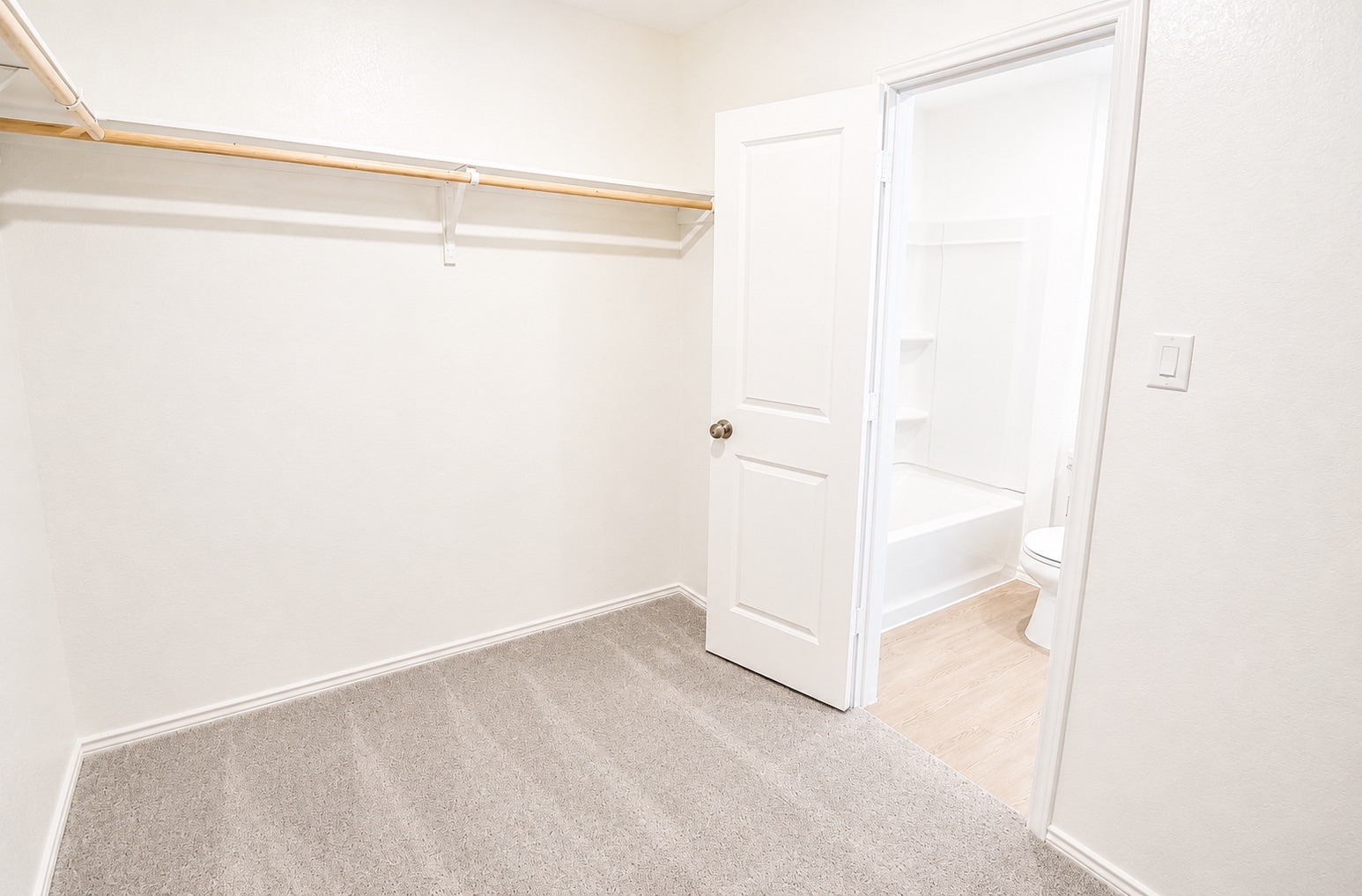 397 Keefer Kyle, TX 78640 - Photo 14 of 33 Ample hanging space for apparel within this practical, neutral-toned closet.