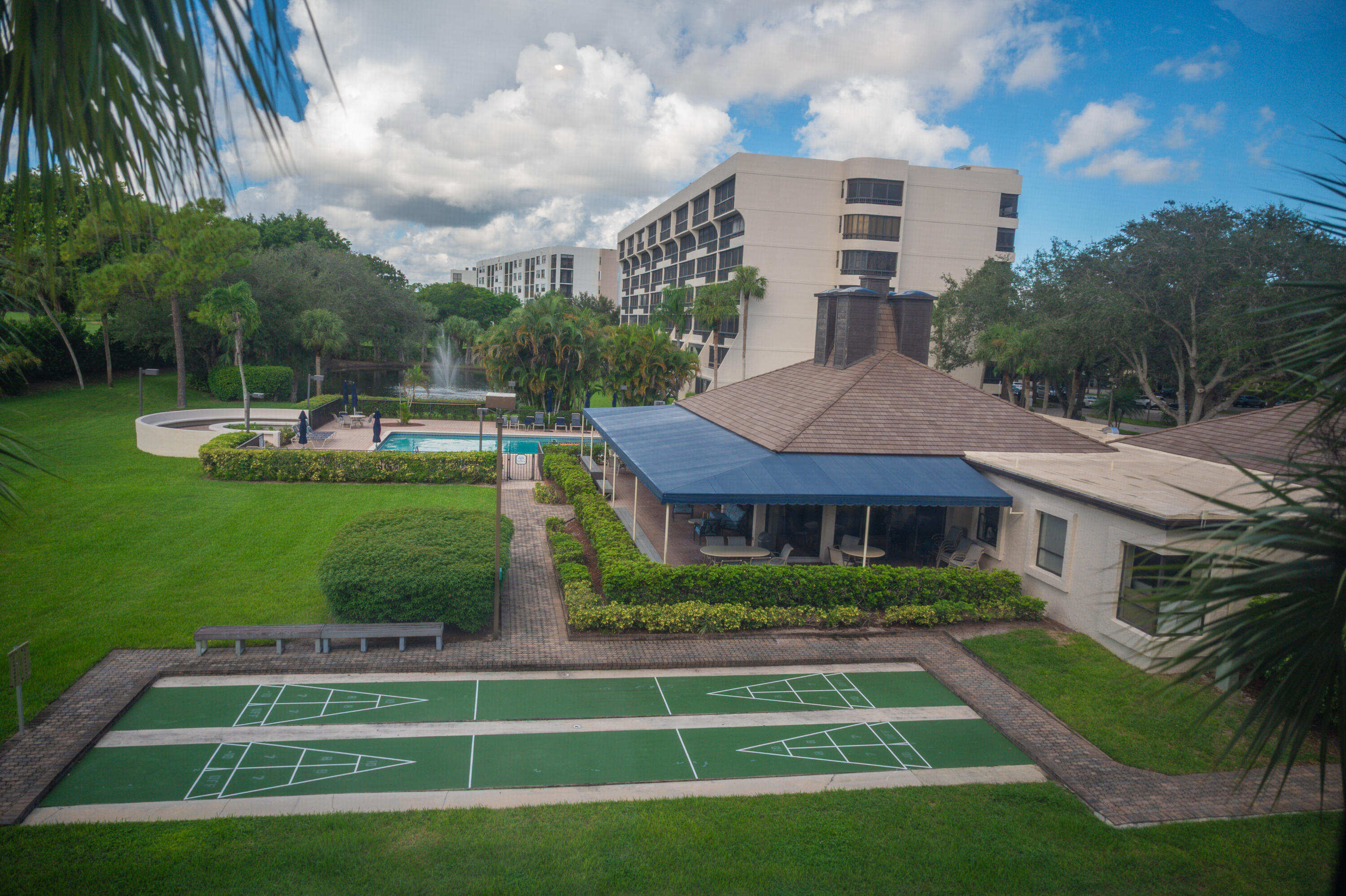 6420 Boca Del Mar Drive, Unit 308 Boca Raton, FL 33433 - Photo 13 of 37 a front view of a house with a yard table and chairs