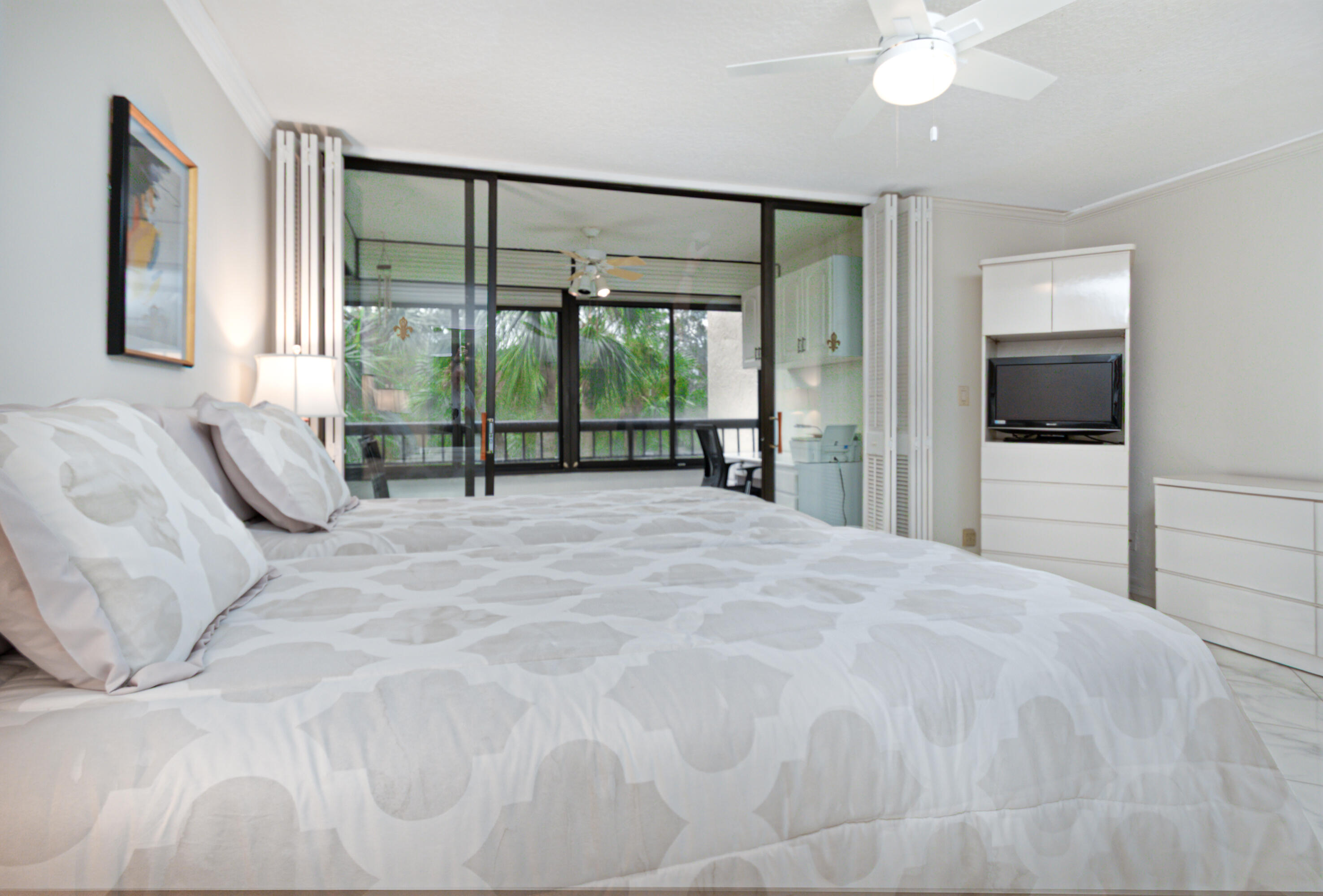 6420 Boca Del Mar Drive, Unit 308 Boca Raton, FL 33433 - Photo 14 of 37 a bedroom with a bed and a large window